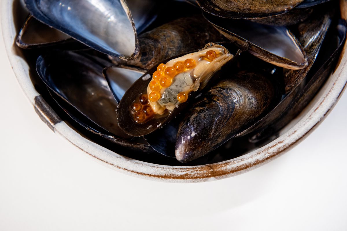Mussels and roe served in a stoneware bowl 