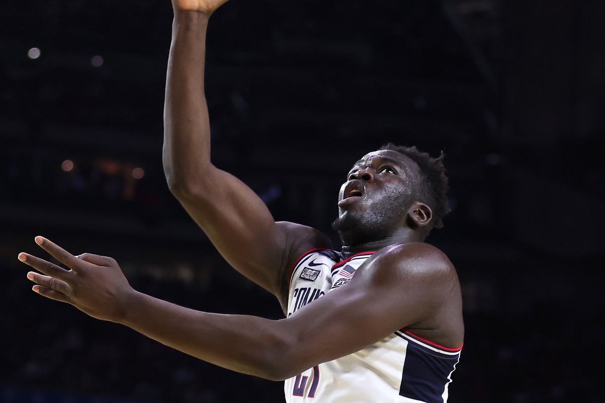 Adama Sanogo of the Connecticut Huskies drives to the basket against Keshad Johnson of the San Diego State Aztecs during the second half during the NCAA Men’s Basketball Tournament National Championship game at NRG Stadium on April 03, 2023 in Houston, Texas.