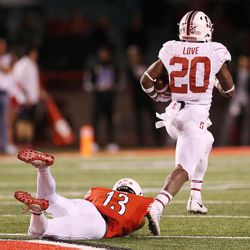 Stanford Cardinal running back Bryce Love (20) runs by Utah Utes defensive back Marquise Blair (13) to score in Salt Lake City on Saturday, Oct. 7, 2017. 