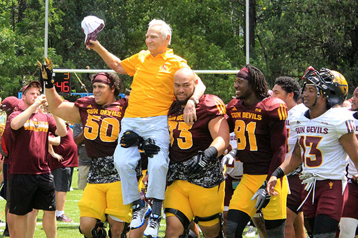 Frank Kush gets carried off the field after Saturday's scrimmage at Camp T.
