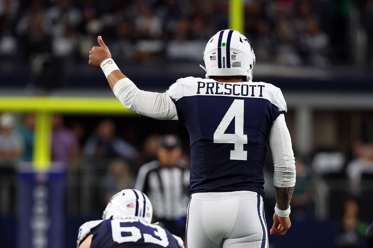 Dak Prescott #4 of the Dallas Cowboys gestures on the field during a game against the Washington Commanders at AT&amp;T Stadium on November 23, 2023 in Arlington, Texas.