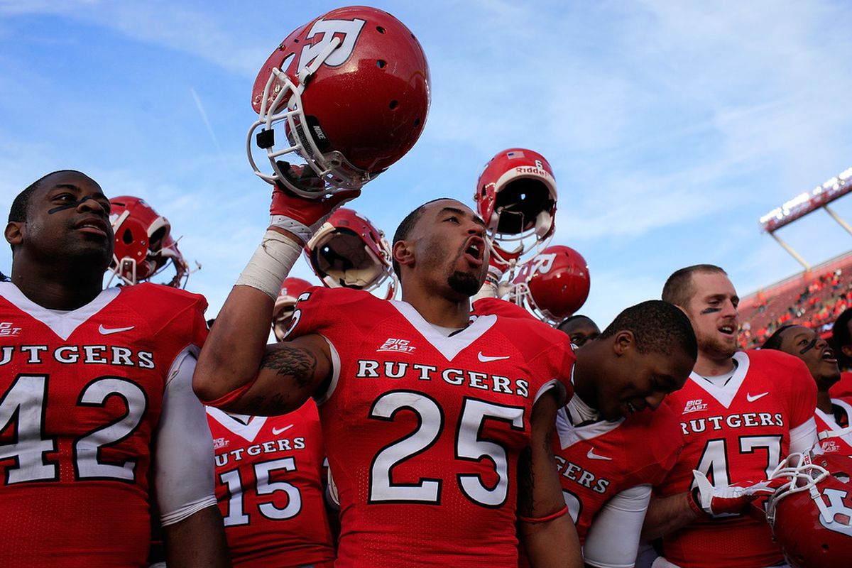 Members of the Rutgers Scarlet Knights celebrate after defeating the Cincinnati Bearcats 20-3 at Rutgers Stadium on November 19, 2011 in New Brunswick, New Jersey.  (Photo by Patrick McDermott/Getty Images)