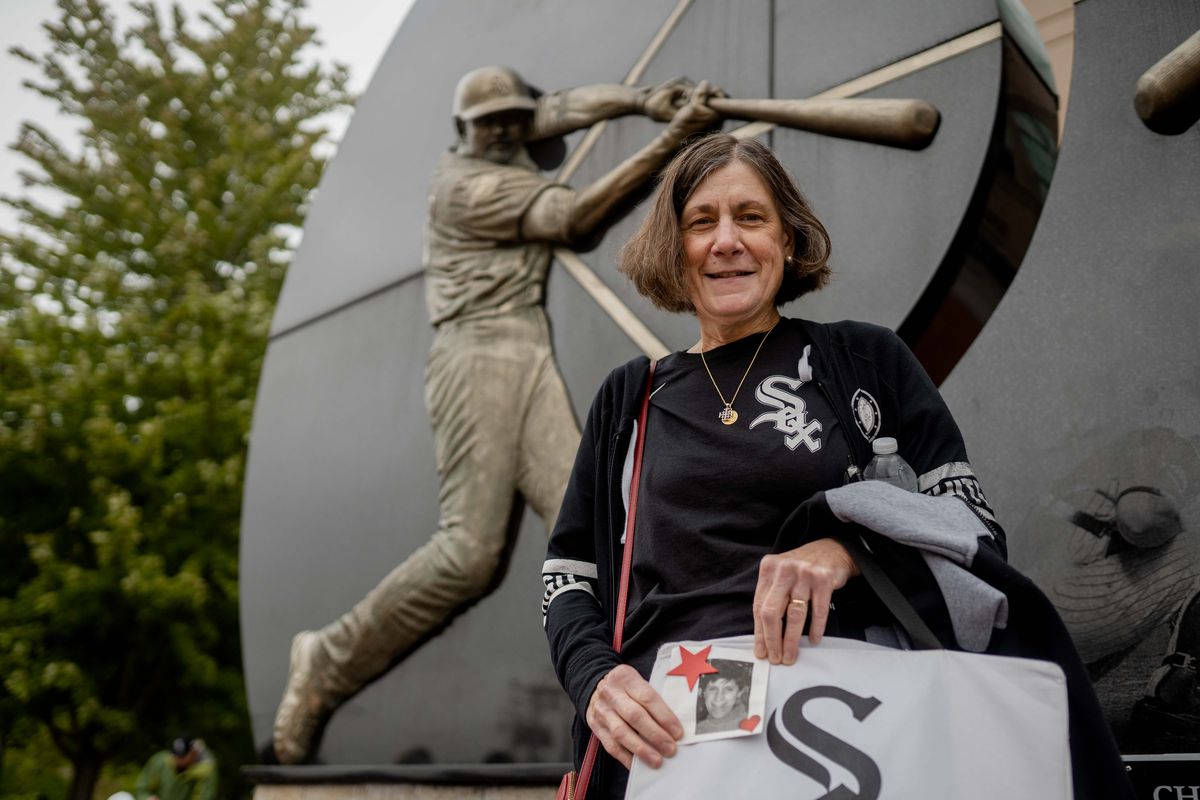 White Sox fan Sharon Bresnahan, who lost her twin sister Sheryl, poses for a photo outside the Guaranteed Rate Field on Oct. 23, 2021.
