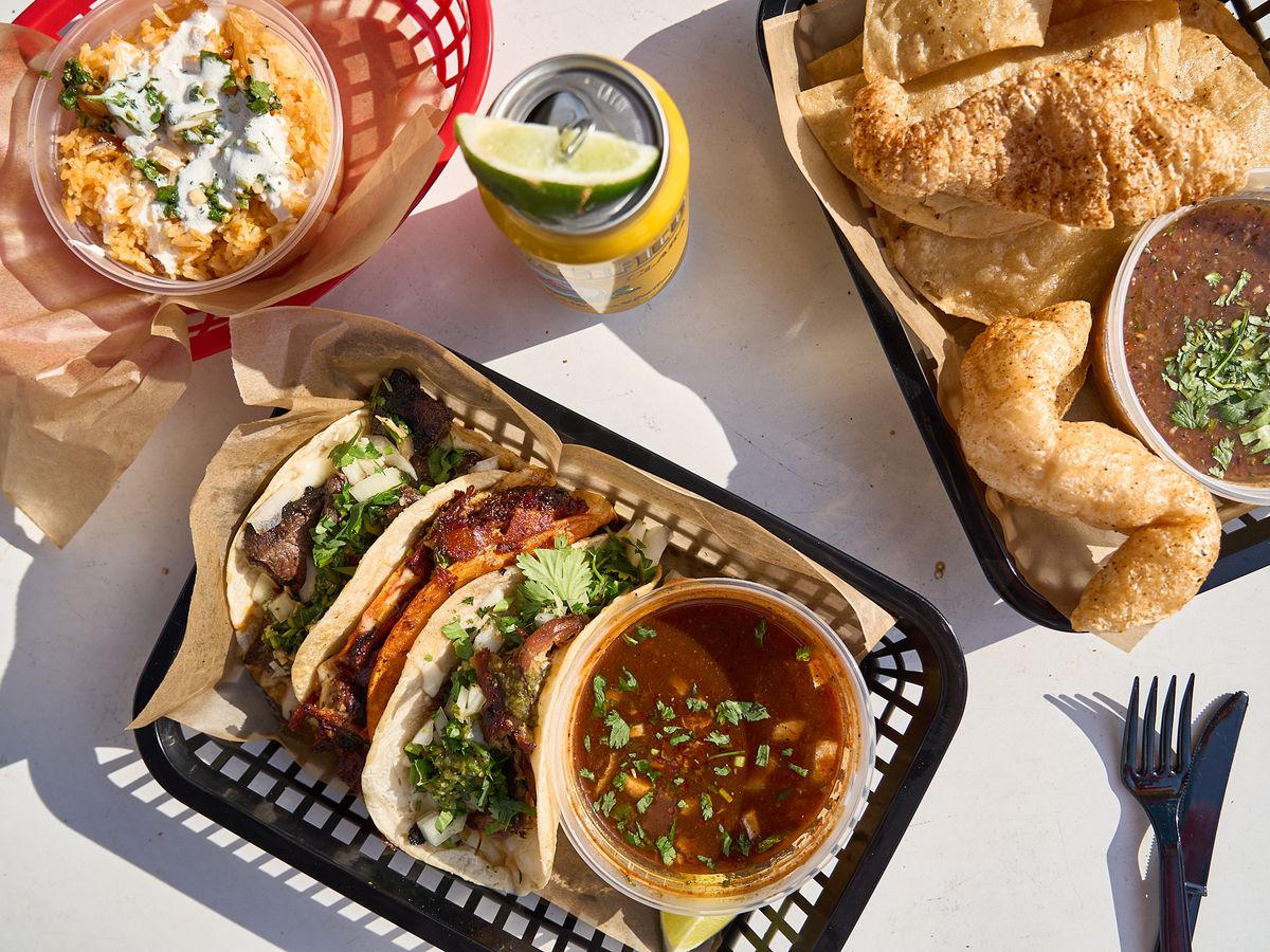 An overhead shot of quesabirria tacos and chicharrones. 