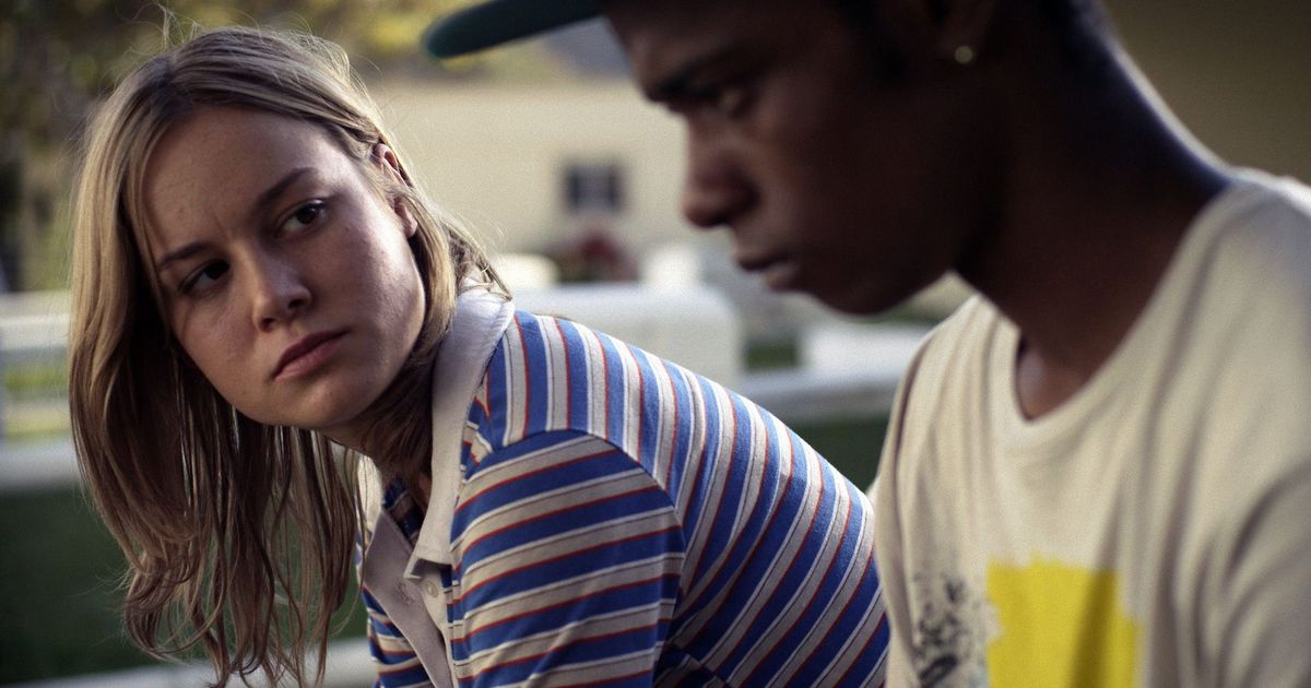 Grace (Larson) looks over at Marcus (Stanfield).