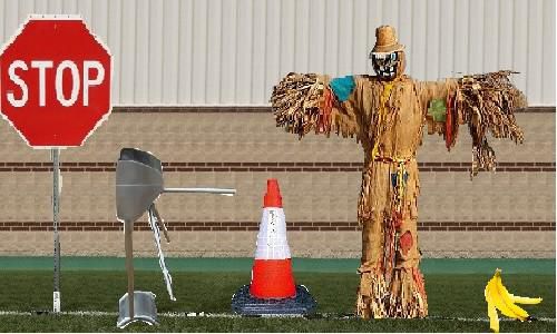 Stop sign, turnstyle, traffic cone, scarecrow, banana peel, acting as an offensive line.