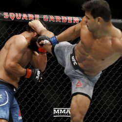 Paulo Costa lands a head kick at UFC 217.