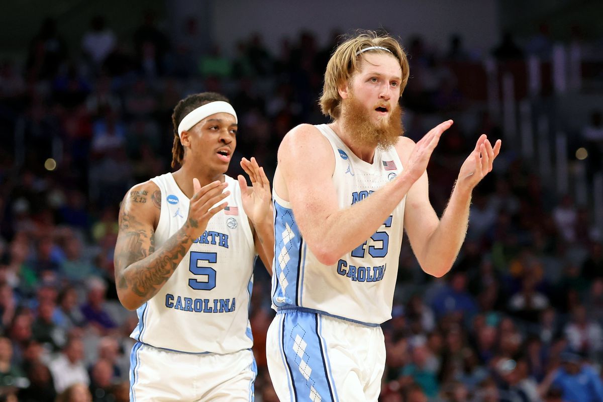 North Carolina Tar Heels forward Brady Manek and forward Armando Bacot react after a play against the Marquette Golden Eagles during the first half during the first round of the 2022 NCAA Tournament at Dickies Arena