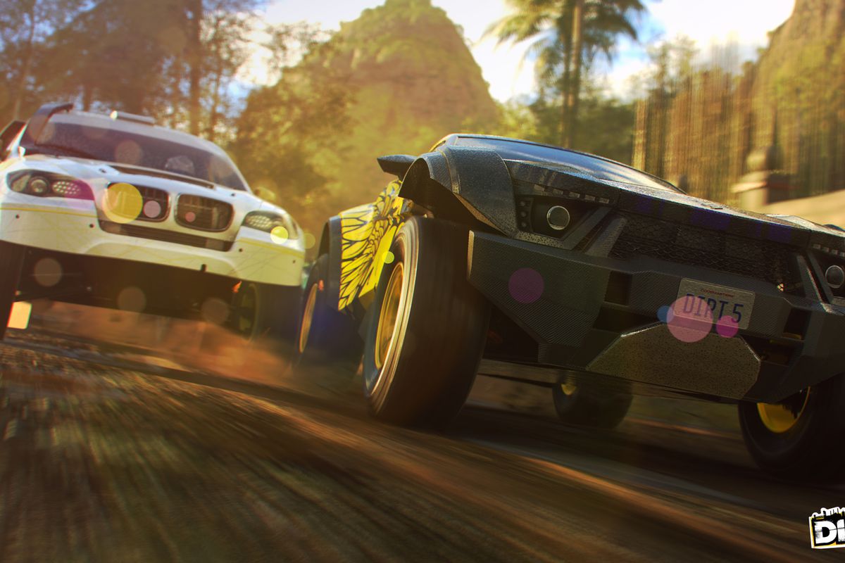 heavy vehicles race through a tropical setting in Dirt 5