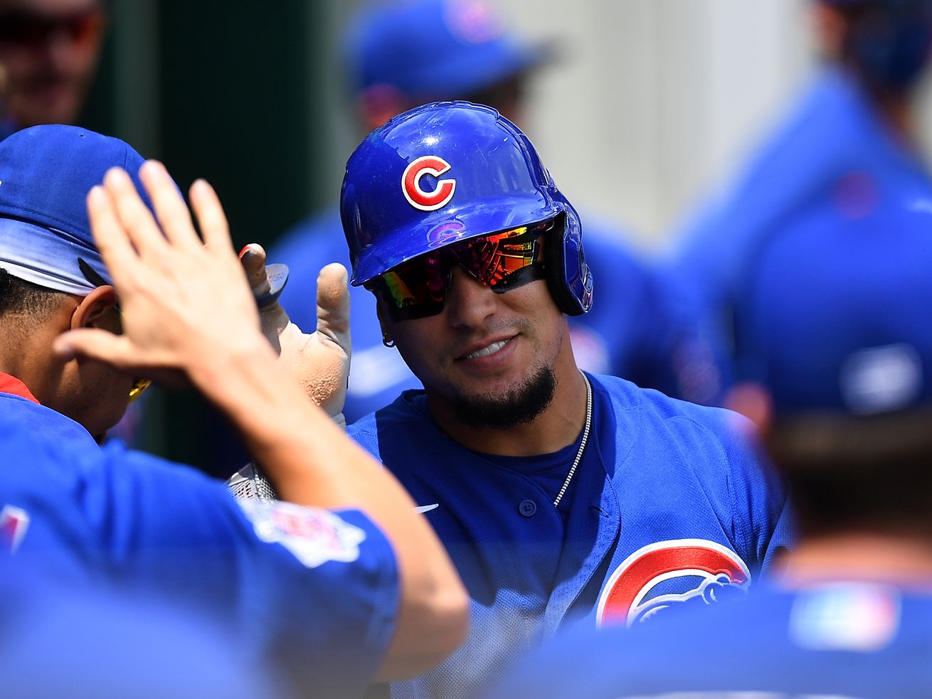 The Cubs’ Javier Baez celebrates with teammates after scoring during the third inning against the Pirates. 