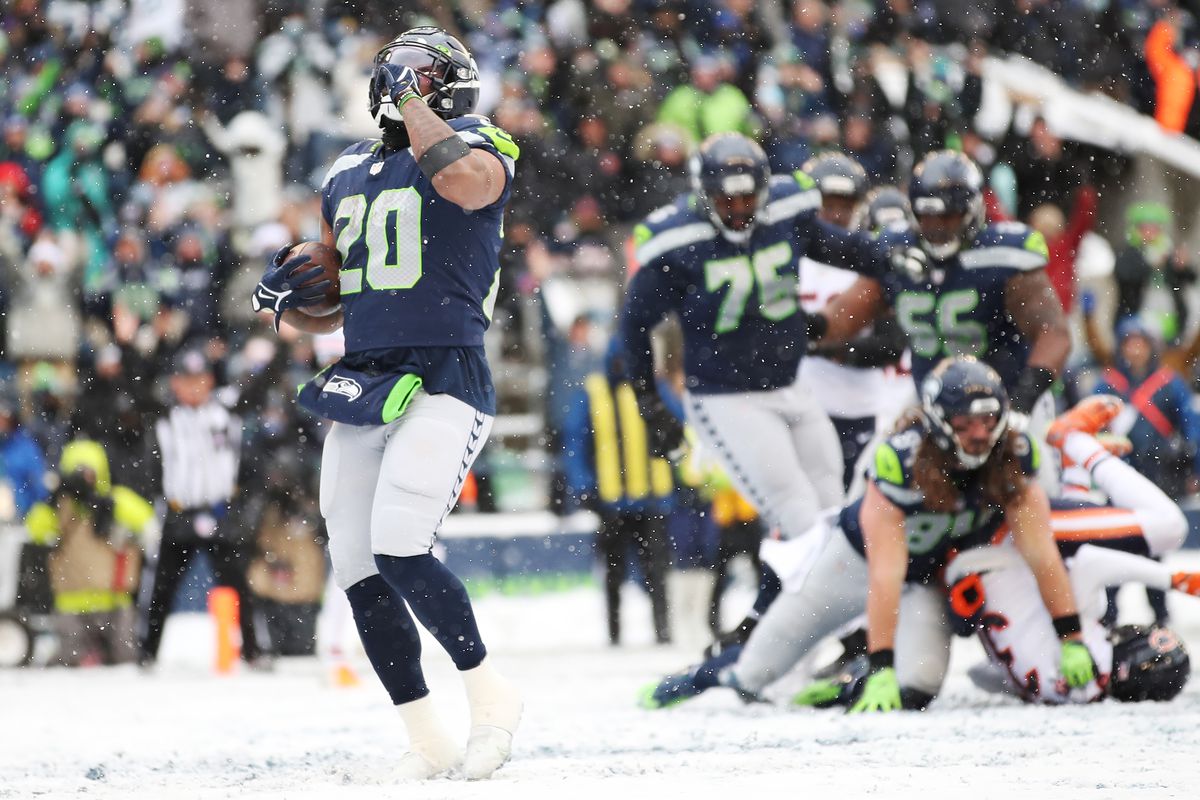 Rashaad Penny #20 of the Seattle Seahawks reacts after running the ball for a touchdown during the second quarter against the Chicago Bears at Lumen Field on December 26, 2021 in Seattle, Washington.