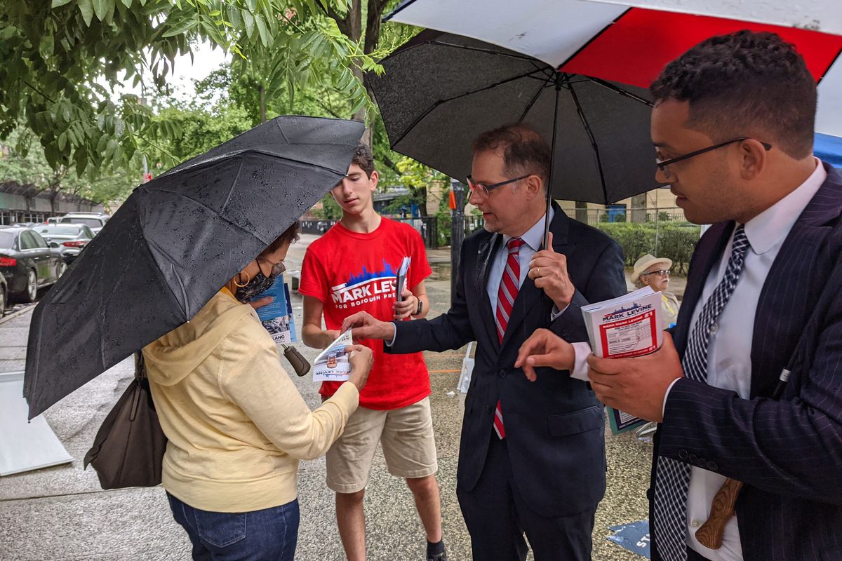 Manhattan borough president candidate Mark Levine speaks with a voter outside P.S. 163 on the Upper West Side, June 22, 2021.