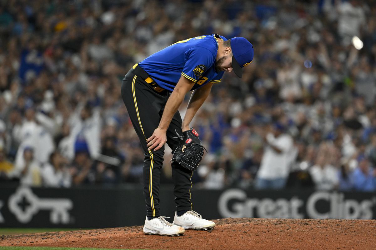 Matt Brash of the Seattle Mariners reacts to giving up a run during the eighth inning against the Los Angeles Dodgers at T-Mobile Park on September 15, 2023 in Seattle, Washington.