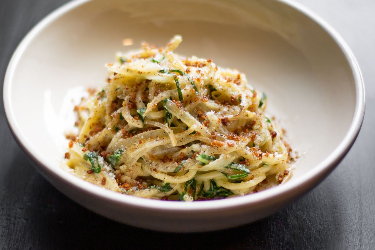 Bucatini in white sauce with guanciale, onions, garlicky breadcrumbs, and grana cheese from Reveler’s Hour