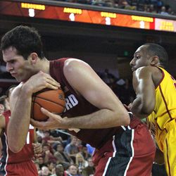 Stefan Nastic rips a loose ball away from Byron Wesley.
