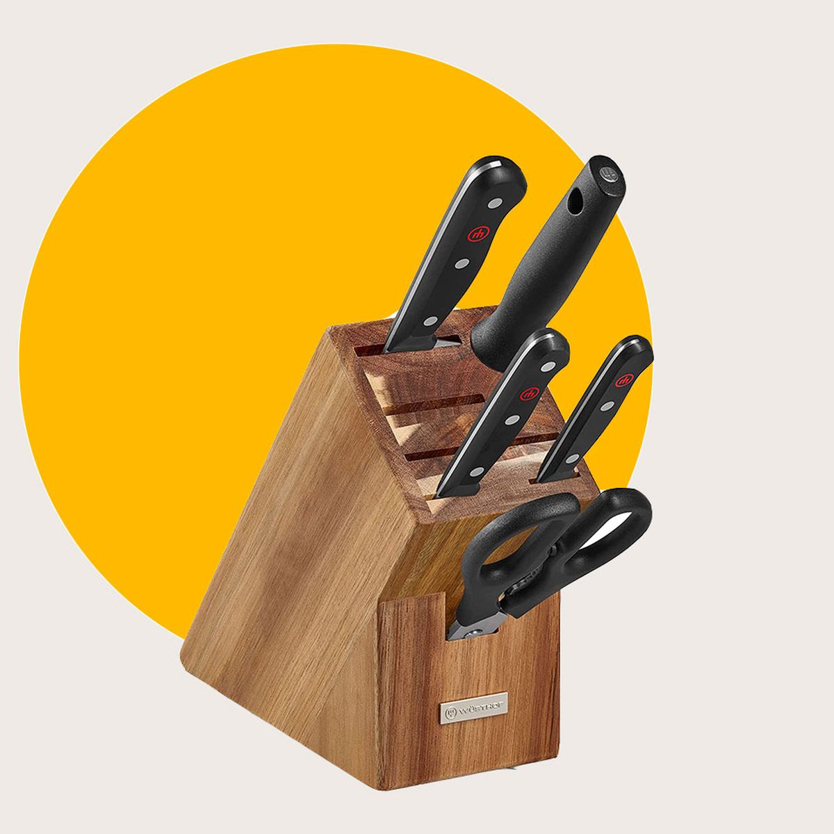 A knife block holding knives and a pair of scissors