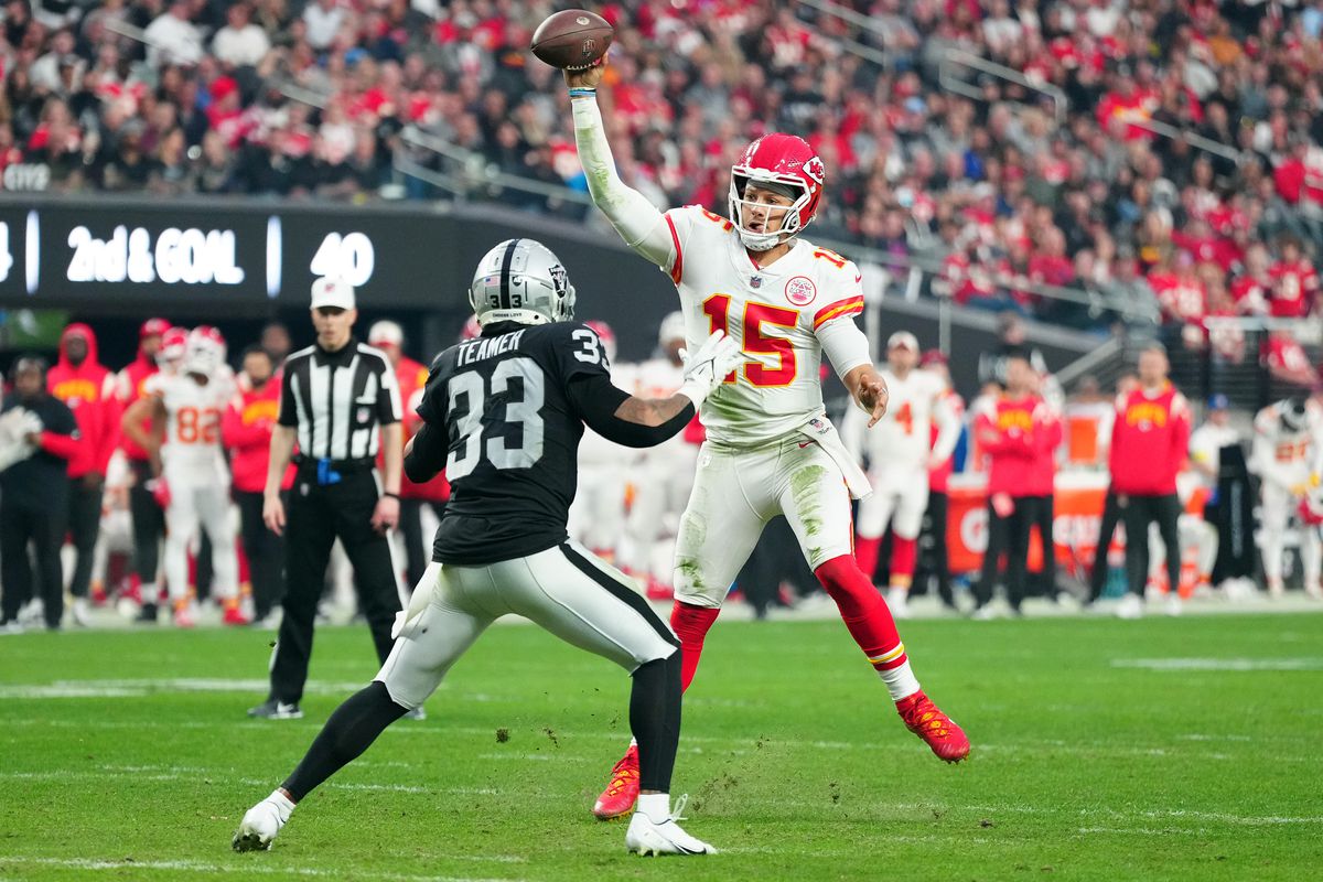 Quarterback Patrick Mahomes #15 of the Kansas City Chiefs attempts a pass against safety Roderic Teamer #33 of the Las Vegas Raiders during the fourth quarter at Allegiant Stadium on January 07, 2023 in Las Vegas, Nevada.