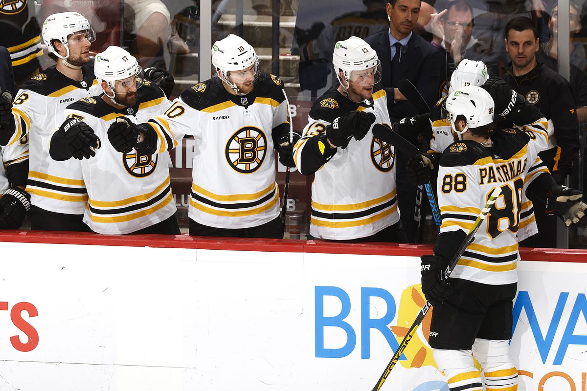 Teammates congratulate David Pastrnak of the Boston Bruins after he scored a third period goal against the Florida Panthers at the FLA Live Arena on January 28, 2023 in Sunrise, Florida.