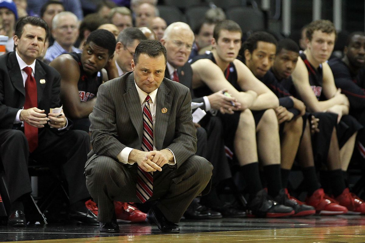 Basketball head coach Billy Gillispie continues his stare-down of Jace Amaro and Kenny Williams.  This is getting weird.  (Photo by Jamie Squire/Getty Images)