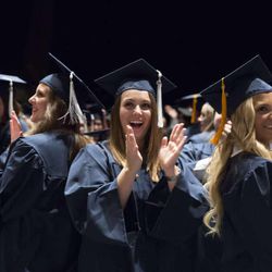 BYU graduates applaude at the conclusion of the summer commencement program on Thursday, Aug. 15, 2013.