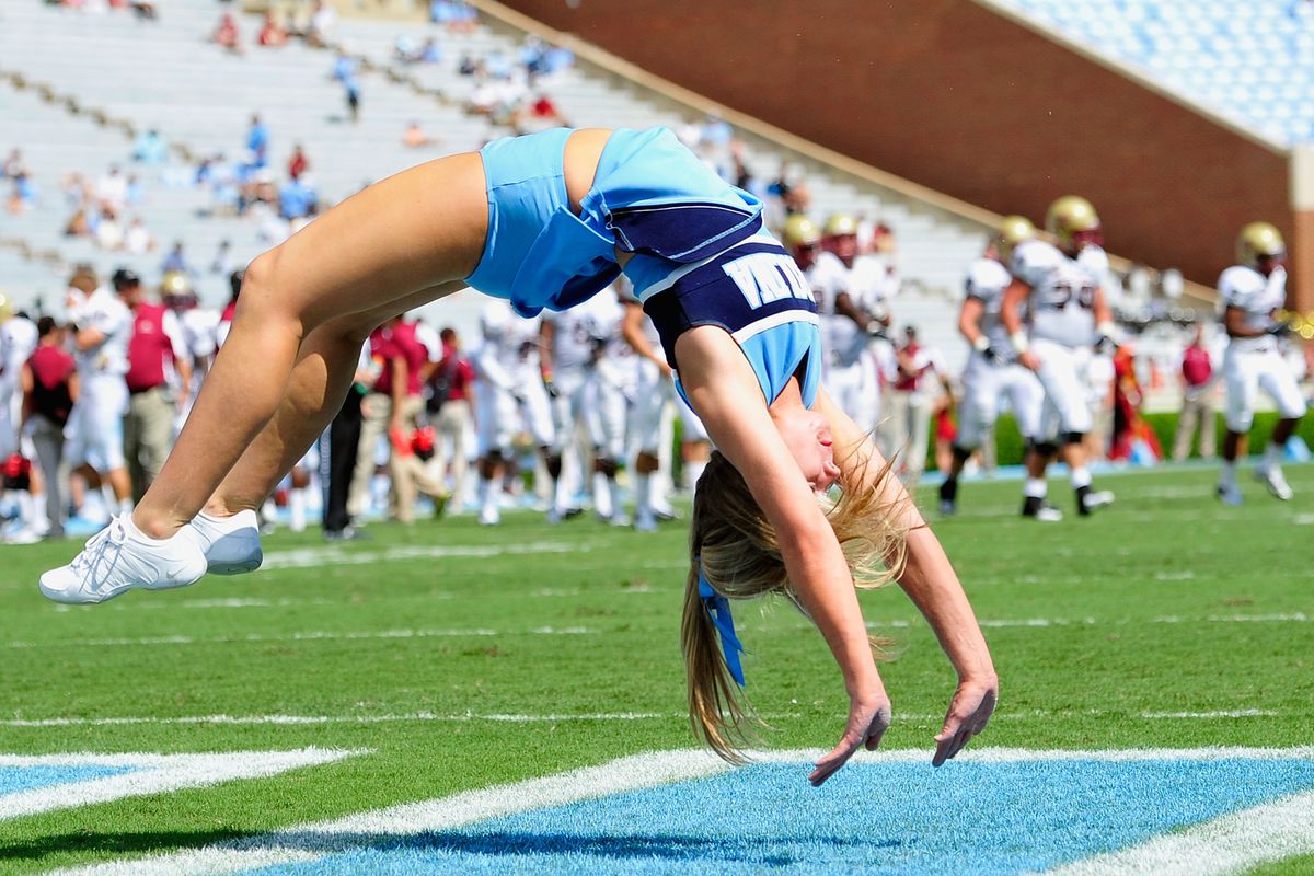 A Tar Heels cheerleader performs during a game against the Elon Phoenix at Kenan Stadium on September 1, 2012 in Chapel Hill.