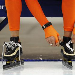A Dutch speedskater laces his skates ahead of a free speedskating training session at the Vancouver Winter Olympics, which start Friday.