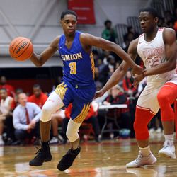 Simeon’s Antonio Reeves (3) drives around Homewood-Flossmoor’s R.J. Ogom (23) during their 58-43 win in Blue Island Friday, March 8, 2019. | Kevin Tanaka/For the Sun Times