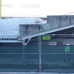Plastic sheet obstructing view into the ballpark, in the left field corner