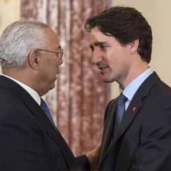 Prime MinisterJustin Trudeau greets former Secretary of State Colin Powell at a luncheon meeting at the State Department in Washington, Thursday, March 10, 2016.