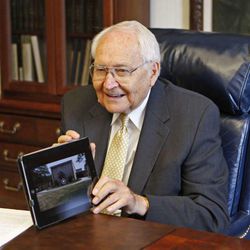 Elder L. Tom Perry  shows some of the photos he has taken while traveling, Tuesday, July 31, 2012, in Salt Lake City, Utah. 