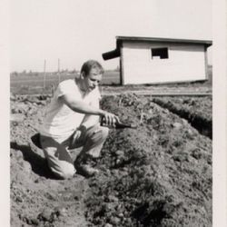 David Lett christening his first plantings, c. 1965. [Source: Linfield College]
