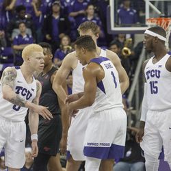 TCU players talk things out after Kenrich Williams took a hard foul.