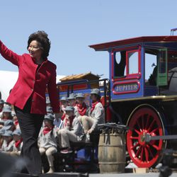 Transportation Secretary Elaine Chao waves to the crowd after speaking during the Golden Spike Sesquicentennial Celebration and Festival at Promontory Summit  on Friday, May 10, 2019.