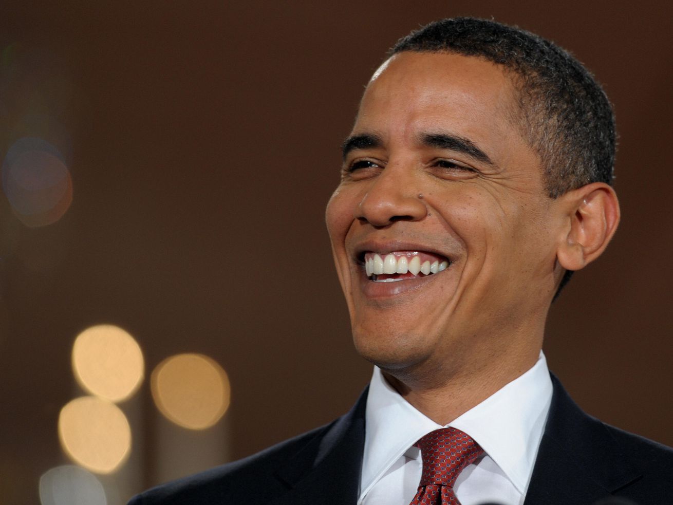 Barack Obama, smiling.