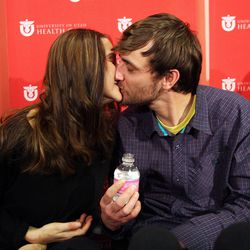 Elisabeth Malloy and Adam Morrey kiss after sharing their story of being caught in a weekend avalanche in Millcreek Canyon Wednesday, Jan. 16, 2013, at University Hospital in Salt Lake City.