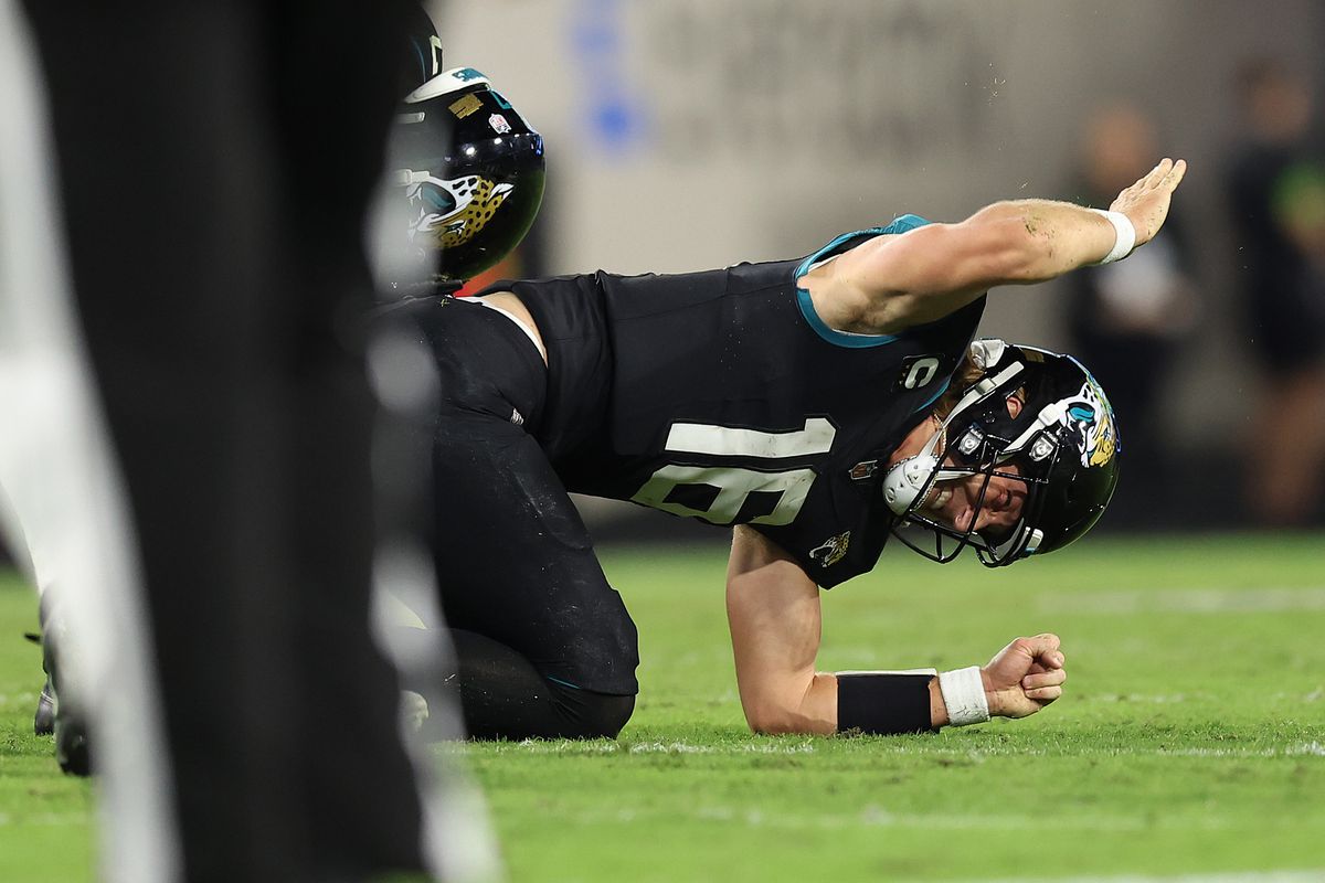 Trevor Lawrence of the Jacksonville Jaguars reacts after being injured against the Cincinnati Bengals during the fourth quarter at EverBank Stadium on December 04, 2023 in Jacksonville, Florida.