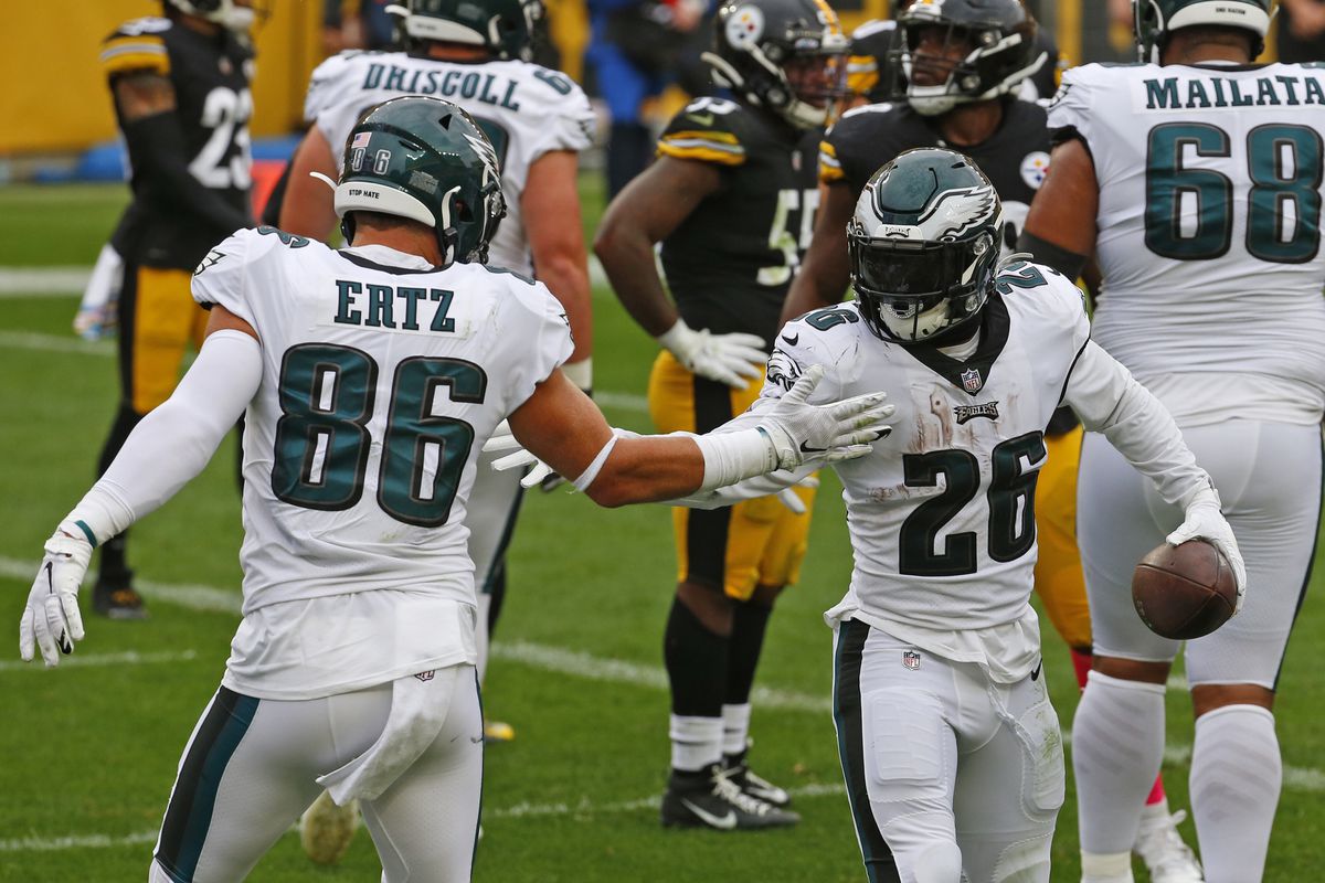 Miles Sanders #26 of the Philadelphia Eagles celebrates with Zach Ertz #86 after rushing for a 1 yard touchdown in the first half Pittsburgh Steelers on October 11, 2020 at Heinz Field in Pittsburgh, Pennsylvania.