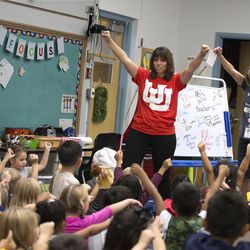 Kindergarten teachers Ashley Bell, left, and Vicki Houmand get their students excited about attending college during Kindergarten College-Ready Day at Midvalley Elementary in Midvale on Thursday, Aug. 31, 2017.