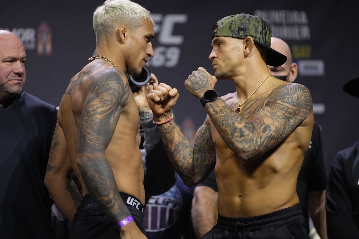 Charles Oliveira and Dustin Poirier during weigh-ins for UFC 269. 