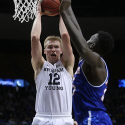 Brigham Young Cougars forward Eric Mika (12) grabs a rebound as BYU and University of Texas at Arlington play in NIT basketball action at the Marriott Center in Provo Utah on Wednesday, March 15, 2017.