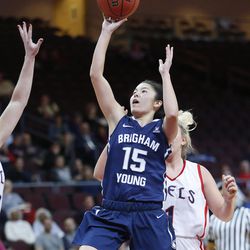 Brigham Young Cougars guard Kylie Maeda (15) drives on Saint Mary's Gaels guard Lauren Nicholson (1) during the West Coast Conference Basketball championships in Las Vegas on Thursday, March 5, 2015. 