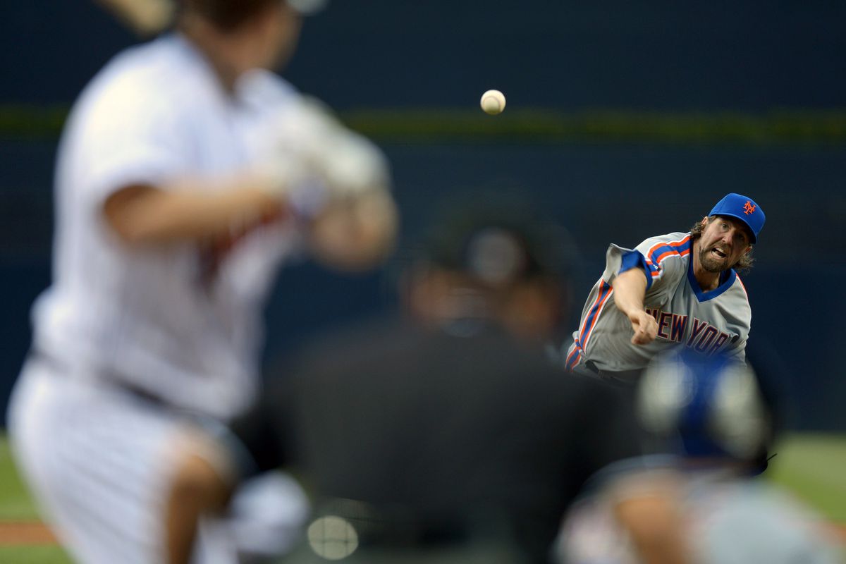 Aug 3, 2012; San Diego, CA, USA; New York Mets starting pitcher R.A. Dickey (43) pitches during the first inning against San Diego Padres third baseman Chase Headley (left foreground) at Petco Park. Mandatory Credit: Jake Roth-US PRESSWIRE