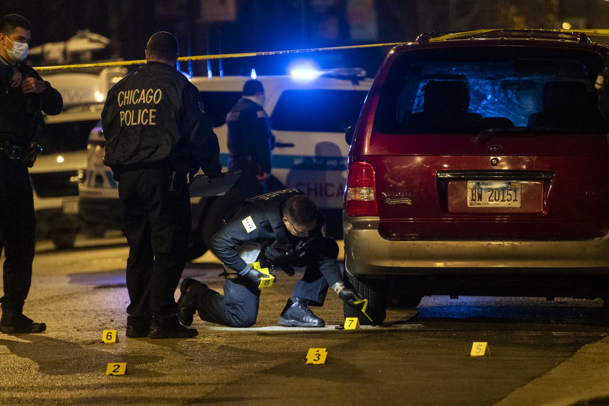 Chicago police investigate the scene where a man was shot and killed and another man wounded in a shooting in the 1300 block of South Homan Ave. in the Lawndale neighborhood, Wednesday, Nov. 11, 2020. | Tyler LaRiviere/Sun-Times