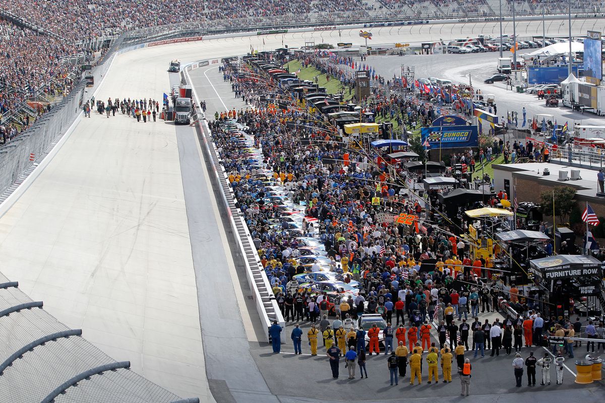 A general view of pit road during the National Anthem prior to the Monster Energy NASCAR Cup Series Apache Warrior 400 presented by Lucas Oil at Dover International Speedway on October 1, 2017 in Dover, Delaware.