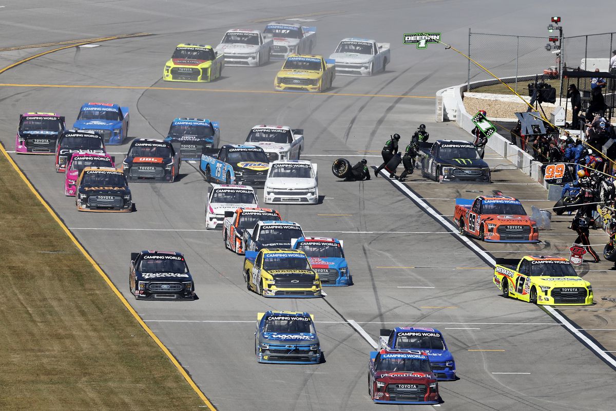A loose tire of the #1 Monster Energy Ford, driven by Hailie Deegan rolls onto the track during a pit stop in the NASCAR Camping World Truck Series Chevy Silverado 250 at Talladega Superspeedway on October 01, 2022 in Talladega, Alabama.