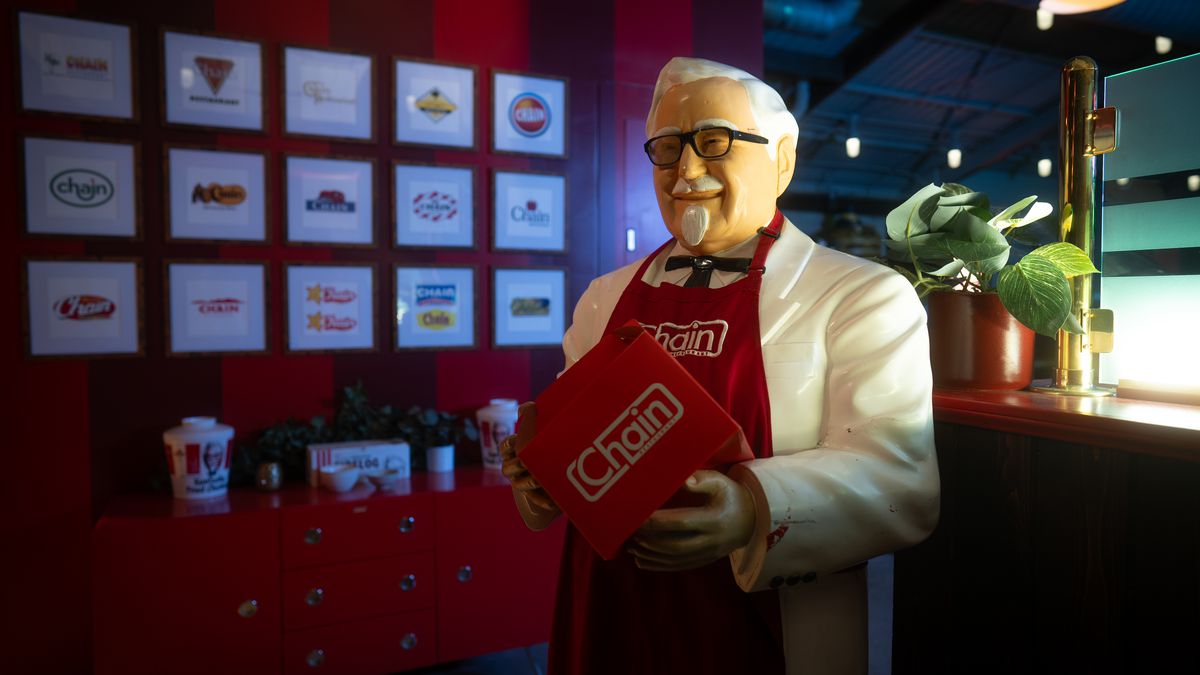 A statue of Colonel Sanders holds a menu at Chain in Los Angeles, California.