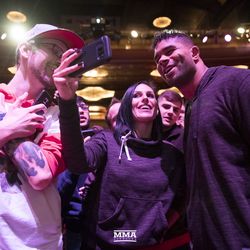 Alistair Overeem poses with fans at UFC 218 workouts.