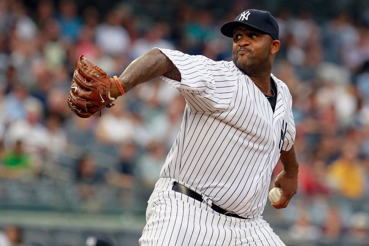 NEW YORK, NY - AUGUST 03:  CC Sabathia #52 of the New York Yankees pitches in the first inning against the Seattle Mariners at Yankee Stadium on August 3, 2012 in the Bronx borough of New York City.  (Photo by Mike Stobe/Getty Images)