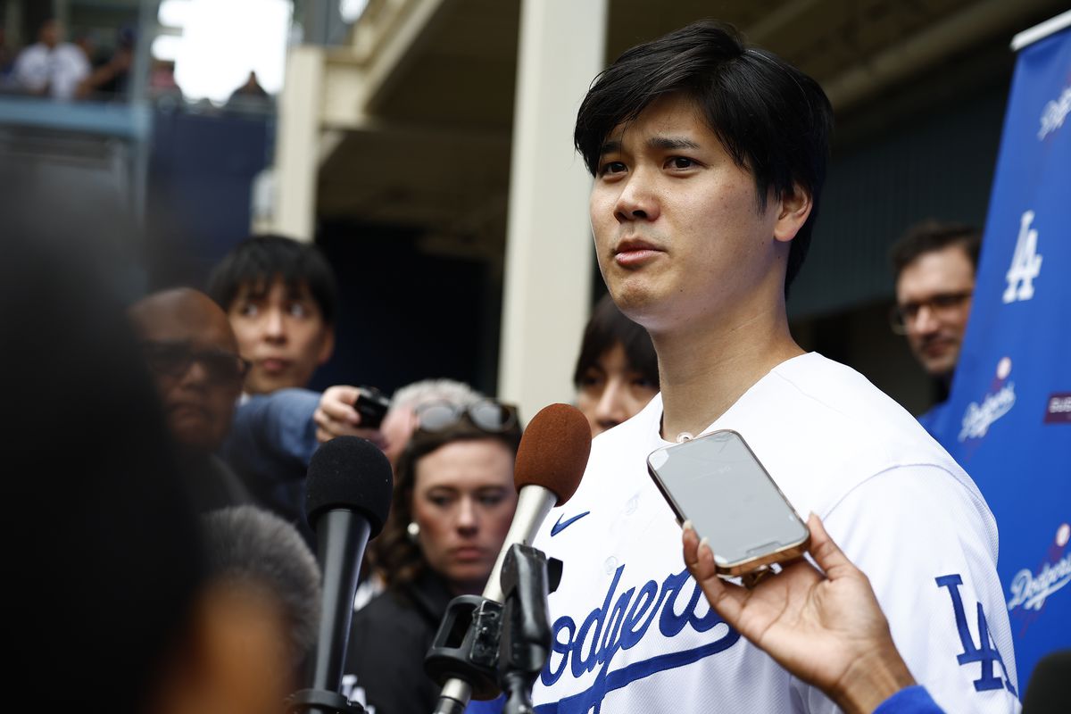 Shohei Ohtani of the Los Angeles Dodgers speaks with the media during DodgerFest at Dodger Stadium on February 03, 2024 in Los Angeles, California.