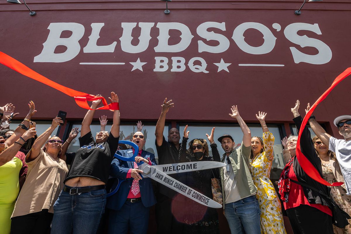 A ribbon cutting ceremony at Bludso’s BBQ.